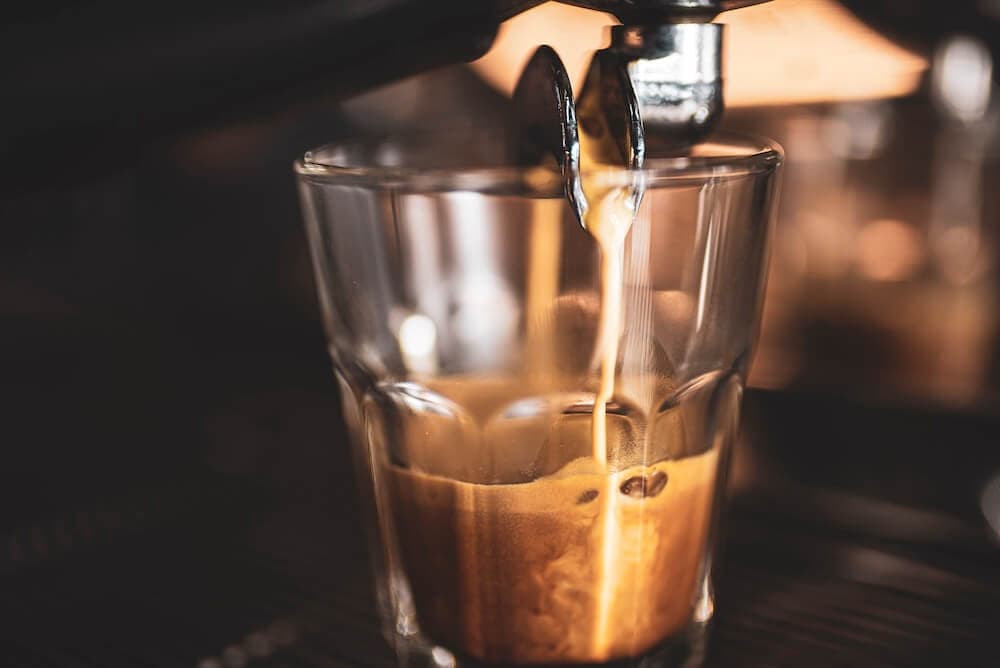 Espresso being poured into a glass at Kawa na Ławę cafe in Zamość