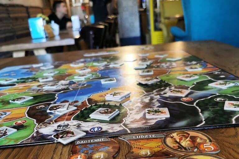 A board game set up on a table at Kawa na Ławę cafe